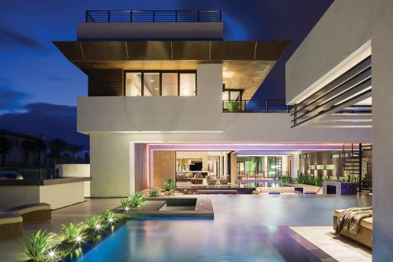 Almost every room in the 2013 New American Home has a view to outdoor spaces, from desert- and Asian-inspired courtyards to water features, landscaping, and both private and public entertainment areas. That mix reinforces the indoor-outdoor intent of the house—an effect enabled by telescoping patio doors that pocket out of sight for seamless transitions.