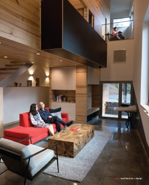 Sora and Doug Pierson. Overhead: a built-in desk projecting from the second/middle level.