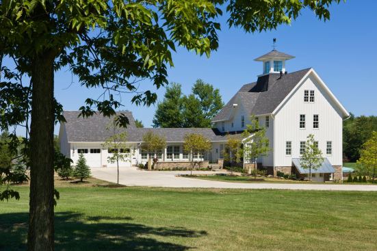 Thompson stayed true to the form for the main house and designed the garage to look like a later addition connected by a breezeway.