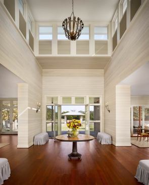 A central axis runs through the main house front porch steps and down the center of the rear lawn to the swimming pool’s covered pavilion.