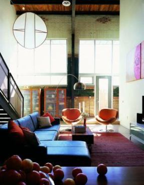 Exposed brick, massive wood beams, and riveted steel trusses give the interiors a garage vibe. The adaptive reuse of these and other materials kept 1,240 tons of concrete and 777 tons of brick out of the landfill. Architect/Interior Designer: Rob Paulus Architect Contractor: Caliber West Developer: Deep Freeze Development