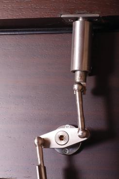 The machined hardware is meant to evoke the solidity of a prewar luxury automobile.