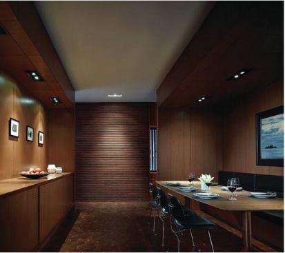 Rough-hewn, industrial materials play well with the sophisticated urban architecture of Wood House. In the dining room, an acoustical plaster ceiling system contrasts with the warm wood veneer wall panels. 
Project:
Wood House, Chicago; 
Architect: Brininstool + Lynch, Chicago; 
Builder: Goldberg General Contracting, Chicago.