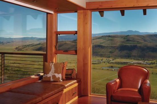 This bump-out perch connects a playroom to the great outdoors through floor-to-ceiling windows and an operable side panel. Leather cushions top a set of drawers to create additional seating and storage.  Custom Home, Summer 2013  
Stephen Snyder Home, Jackson, Wyo.  Carney Logan Burke Architects, Jackson