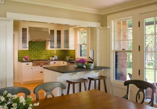 Crisp details bridge the gap between traditional and modern in this Shingle-style seacoast house. While the kitchen is compact and contemporary, the dining room flows in making for an open plan space that’s clearly defined. 
Project:
River Point, South Coast, Mass.; 
Architect: Albert, Righter & Titmann, Boston; 
Builder: Roger Wilkie Builder, Tiverton, R.I.