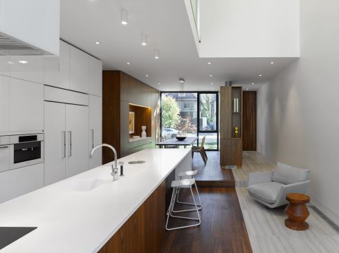 The kitchen includes a small sitting area.