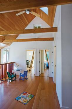 Children's bedrooms spill out to an airy play loft.