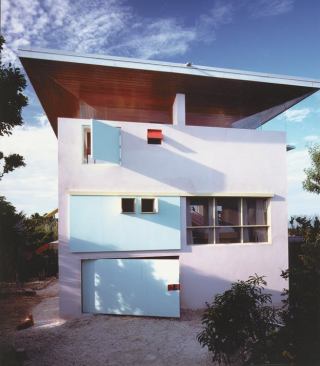 Architect Frank Harmon, FAIA, worked with client Jim Taylor to devise a collection of sliding doors, flaps, and shutters that enable the owners to seal off the house from storm winds and rain.