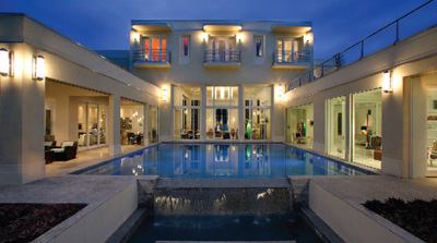 Simplicity was the imperative in designing the railing for this 8,818-square-foot art deco home, according to architect Mark Nasrallah. The rail's clean, curvilinear motif perfectly complements the bold, geometric elevation of the Floridian house.