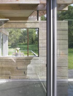 The master bedroom looks out onto the fountain pool as well as the river (not visible in this photo).