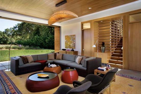 The white oak-wrapped great room offers a comfortable year-round respite. Sliding screens admit cross-breezes while keeping the bugs at bay.