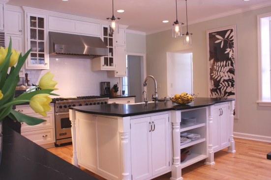 This farmhouse had received several updates and renova-
tions over the years. However, the floor plan was conflict-
ing amongst the kitchen, laundry, mudroom, and powder 
room. A complete reorganization of the first floor was 
achieved through multiple structural changes that al-
lowed for a larger kitchen and created better flow be-
tween adjacent rooms. The kitchen includes custom 
painted cabinetry, a farmhouse style sink, and soapstone 
countertops. A commercial size Viking range, hood, and 
Sub Zero refrigerator bring a theme of stainless steel to 
the kitchen which is accentuated by brushed nickel hard-
ware and island faucet. Specialty lighting, glass door 
cabinets, and a grand, eight foot island are just a few of 
the features that make this kitchen stunning.