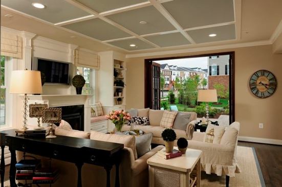 Lower-level rooms have standard 9-foot ceilings, and folding doors open the space to the outdoors.
