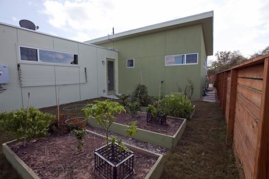 A third outdoor area provides space for an herb garden.