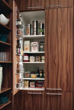 Wood-Mode’s Brookhaven I walnut laminate kitchen cabinetry sports modern lines and a furniture-like look for up to 50% less than the company’s walnut veneer cabinets. www.wood-mode.com.