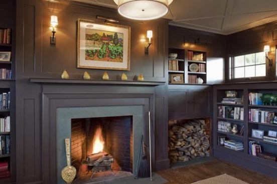 The library of this New England farm house is made extra cozy by incorporating firewood storage in with cabinetry and bookcases. Project: Hillside Farmhouse, Boston; Builder; Robert Lawrence Builders, Westwood, Mass.; Architect: Albert, Righter & Tittmann Architects, Boston