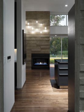 Main-level floors are dark-stained walnut.