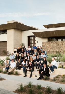 The team at Blue Heron, led by Las Vegas native and second-generation builder Tyler Jones (seated, lower center), has refined a design/build business model for the high-end of the local housing market, a streamlined process that enables a focus on creative solutions instead of clashing egos. Architect Michael Gardner (seated, farthest right) and interior designer Lyndsay Janssen (seated next to Gardner) head up the design side. Kris Osterling (seated, front row, white shirt), served as construction project manager, while Shelly Stewart (directly behind Jones) is director of sales and marketing.