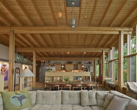 With its open plan, exposed structure, and celebration of natural materials, the kitchen great room offers an earthy interpretation of Modernism.