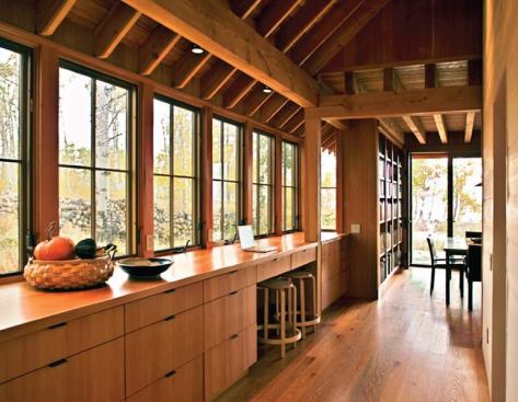 The broad, sheltering roof that marks this house from a distance also defines its living spaces.