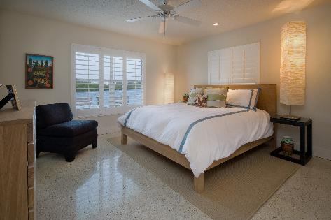 A new master suite with lanai were added to the end of the house. Retractable screens are incorporated into the lanai structure for insect control. In addition, a mosquito-control misting system was added to the home's entire back elevation.