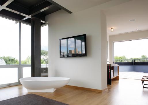 The designers added a third floor to the building so that in this open plan home, the parents� had privacy in the form of a master suite.