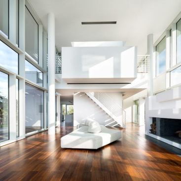Living room, with a view toward the second level and office loft.