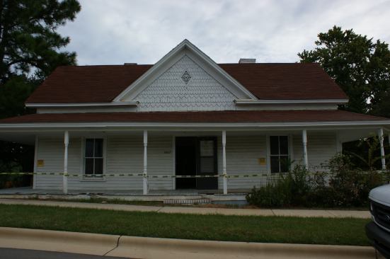 Before moving and renovation, the farmhouse sat perilously close to a road that had been widened for a new housing development.