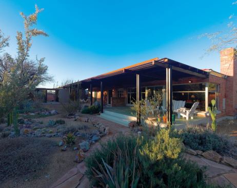 An addition to a one-story home in Tucson, Ariz., consists of a painting studio, porch, workshop breezeway, and storage room.