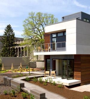 Located in the courtyard of Chicago's Museum of Science and Industry, the Smart Home: Green + Wired house showcases the form and function of green, urban living, with an open, loft-like layout and a range of sustainable features.