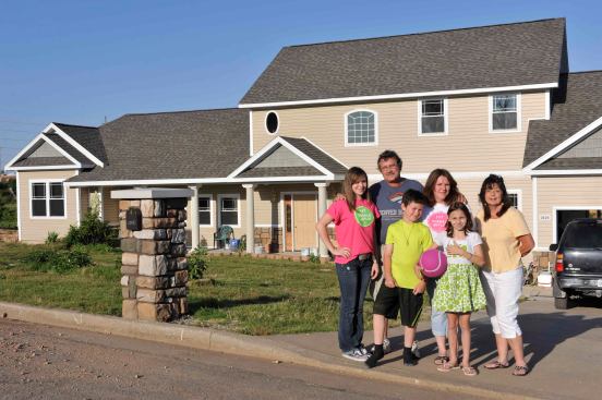 Back row, left to right: Dianne Huddleston, Kenny Huddleston, Judy Stanley. Front row, left to right: Emily Huddleston, Michael Huddleston, Maggie Huddleston. After surviving the experience of driving into the teeth of the tornado in their Chevy Suburban, the Huddlestons have spent more than a year rebuilding their house in Joplin with the help of Dianne’s sister Judy, who grew up in Joplin but is now retired from a career as a professional homebuilder in Kansas City.