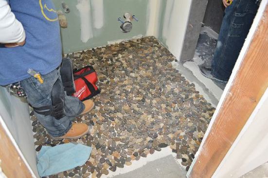 Pebbles will provide a spa-like feeling underfoot in the shower.