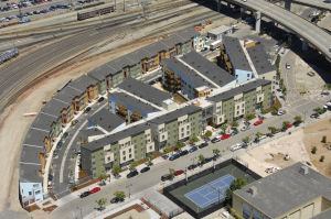 Wedged between commuter rail tracks and an elevated freeway, this unwanted patch of land was noisy, odd-shaped, and in serious need of brownfield remediation. Architect: David Baker + Partners Builder: Nibbi Brothers Developer: The Related Companies of California