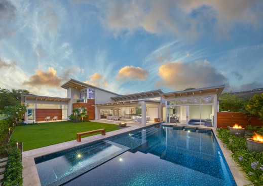 The second floor recreation room opens to a lanai, which provides a panoramic view and its soaring roofline creates a focal point.