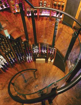 A circular stairway of reclaimed wood occupies the center of the structure.