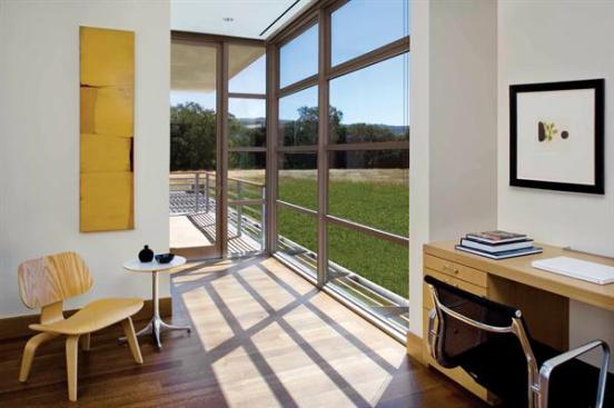 A powder room and two offices-each with a balcony-occupy private space on the second floor.