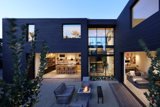 The kitchen features a mix of dark and light wood. 