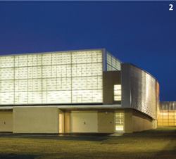 At the center of the detention center's recreation yard is the gymnasium, its Kalwall panels acting as a lantern.