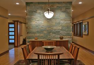 Inside, horizontal runs of cherry trim span walls and wrap corners, creating a continuous flow from one room to the next. Architect: GTM Architects Builder: Ebner Construction General contractor: homeowners