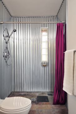 The corrugated steel used for the shower was a green choice, but it also turned out to resemble the punched-tin work that’s typical of southwestern folk art. The project superintendent crafted the shower, and the owners had him sign it upon completion.