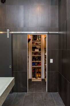 Behind another "barn door in the master bath is Cheryl Serdar's special designer shoe storage/display closet.