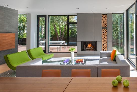A floor-to ceiling niche turns firewood storage into a design element.