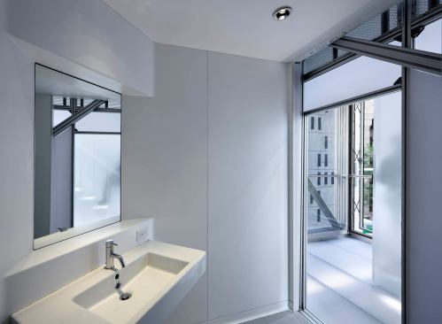 The Cellophane House was fabricated in chunks like this bathroom, which is a single cube.