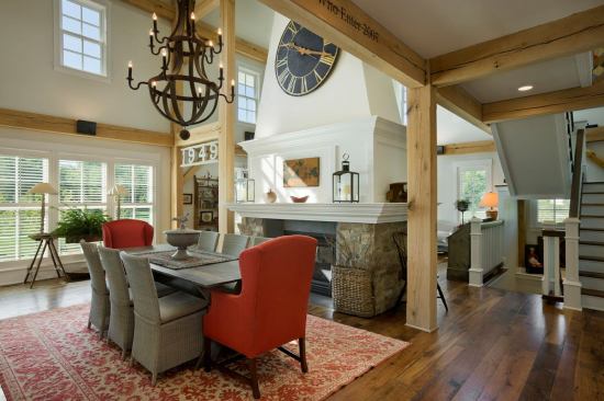 The glass-filled cupola rises directly above the dining room table with an oversized iron chandelier hanging from the center.