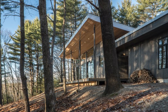 Exterior view of the house  - the surrounding woods offers privacy and   scenic views. 