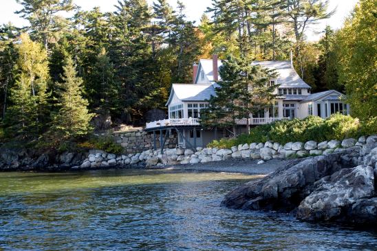 Stone walls add the perfect amount of grandeur to this seaside home, while keeping in step with its pristine landscape. Project: Maine Seaside House, Bar Harbor, Maine; Architect: Barnes Vanze Architects, Washington, D.C.; Builder: Classical Endeavors, Ellsworth, Maine