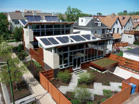 This LEED Platinum-rated, net-zero energy house overcame the dual challenges of its urban setting and northern climate. Solar panels mounted on butterfly roofs produce hot water and electricity.