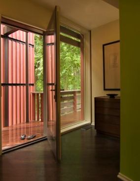 Decks and raised terraces at all levels allow for on-level access and connection to the outdoors.