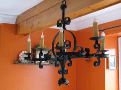 From the Forge  From the maker's French Iron Collection, the Lafitte Chandelier is made of hand-forged iron and features beautiful scroll work. Available in flat black or rust finishes, the chandelier measures 24.5 inches high, 34 inches wide, and 16 inches deep, and also can be ordered in custom sizes. 
Bevolo Gas & Electric Lights | 504.522.9485 | bevolo.com