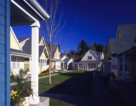 To maintain a 14-unit-per-acre density and still give buyers access to outdoor space, Mithun designed the homes around common courtyards. When residents want to spend time outside, they have the choice of using either the shared courtyard or their own back porches. For more information on this project 
click here.